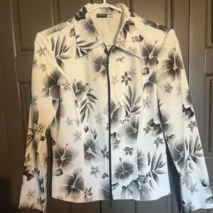 White with black/grey floral jacket. Size would fit medium. Canadian made